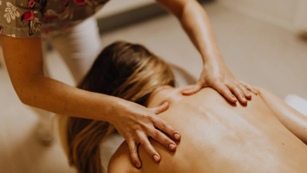 Woman on budget Getting massage from a Female Therapist 
