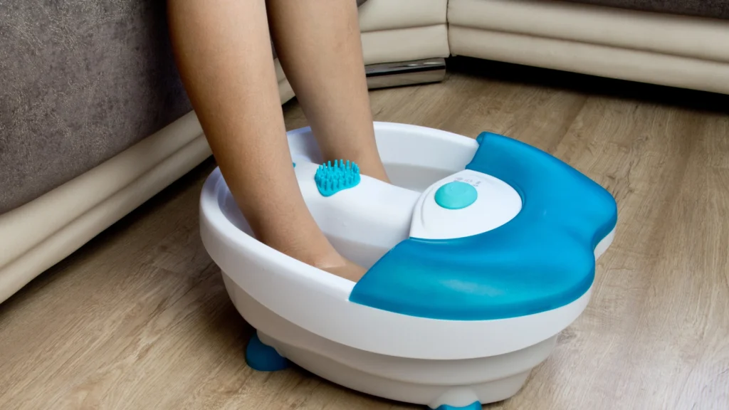An Electric water foot massager being used by a female