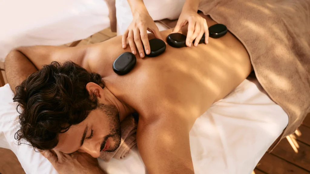 Male Client getting Hot Stone Massage